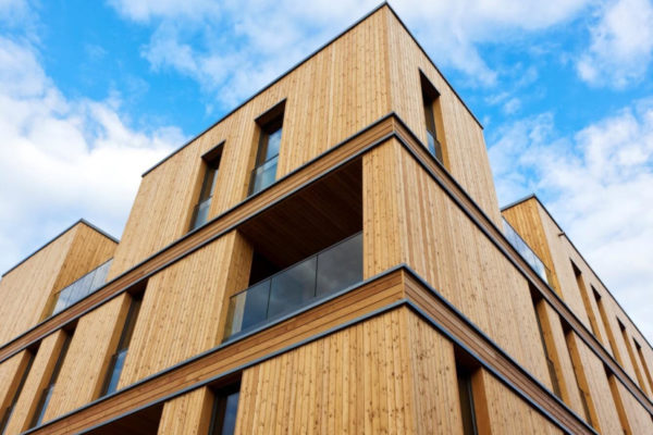 A wooden residential building|leed logo|A wooden residential building