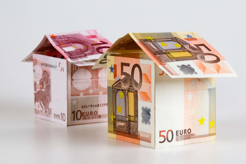 Little houses made from Euro paper currency|