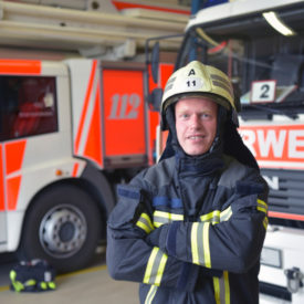 portrait of a firefighter in the operations centre at the fire-fighting vehicle|fire sprinkler and detector