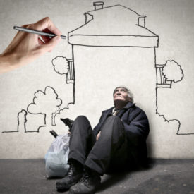 Homeless man is sitting on the ground while hand is drawing a house on the wall||graph