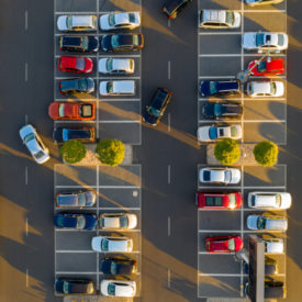 Top down view from drone on mall parking with many cars.|Top down view from drone on mall parking with many cars.