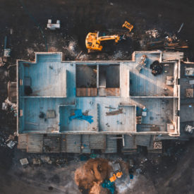 Drone footage of the inside of a house under construction surrounded by building equipment taken at sunrise in spring 2019|Drone footage of the inside of a house under construction surrounded by building equipment taken at sunrise in spring 2019|From a bird’s view to drone’s view - 7 changes drones are making in the construction industry