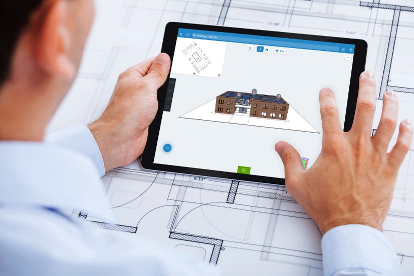 Architect using a tablet to view a BIM model