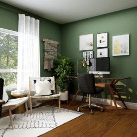 A home office with dark green walls and a calm atmosphere.