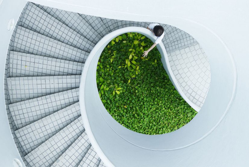 image of a person in a green building