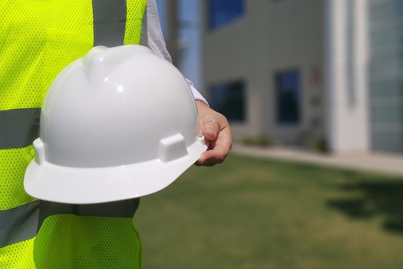 image of a construction quality manager with a hard hat
